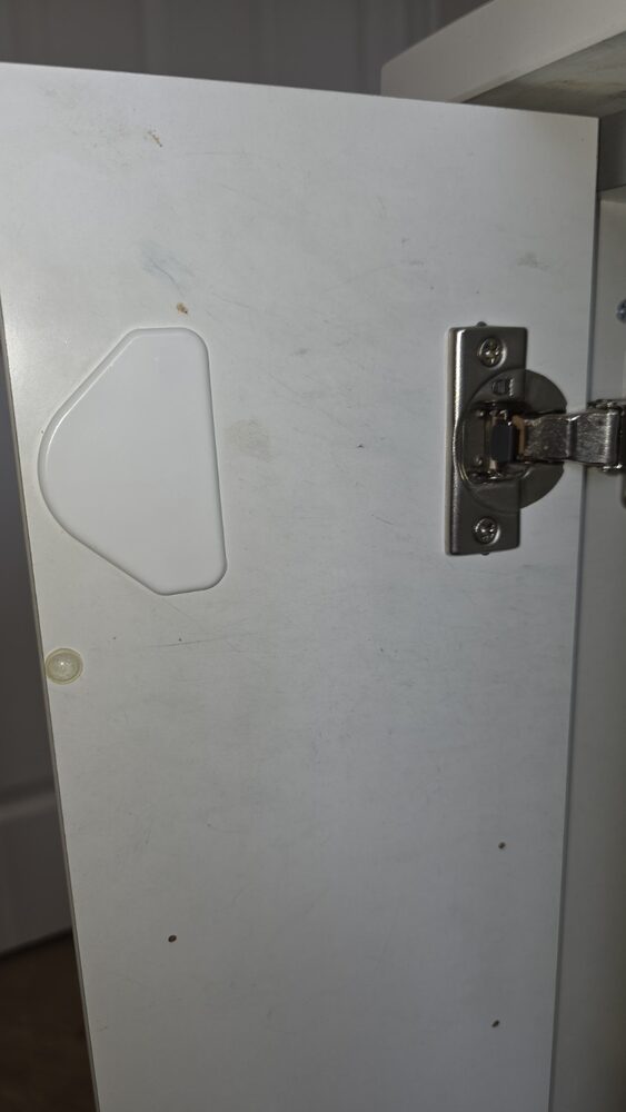 Cupboard interior before a builders clean